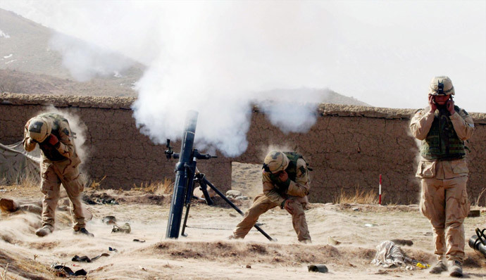 US Army 10th Mountain soldiers shoot at an enemy position with their 120mm mortar 09 March 2002 near the villages of Sherkhankheyl, Marzak and Bobelkiel, Afghanistan. (AFP Photo / Pool / Joe Raedle)