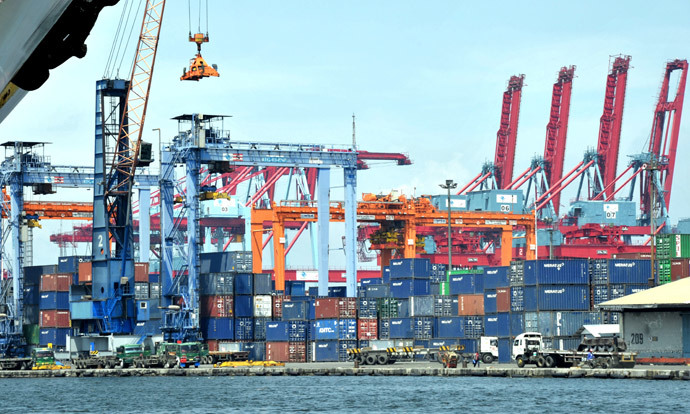 A crane stacks shipping containers at the international container port in Tanjung Priok, North Jakarta (AFP Photo / Bay Ismoyo)