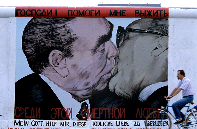 Graffiti by Russian artist Dmitry Vrubel: kissing Leonid Brezhnev and Erich Honecker on the Berlin Wall (RIA Novosti / Boris Babanov)