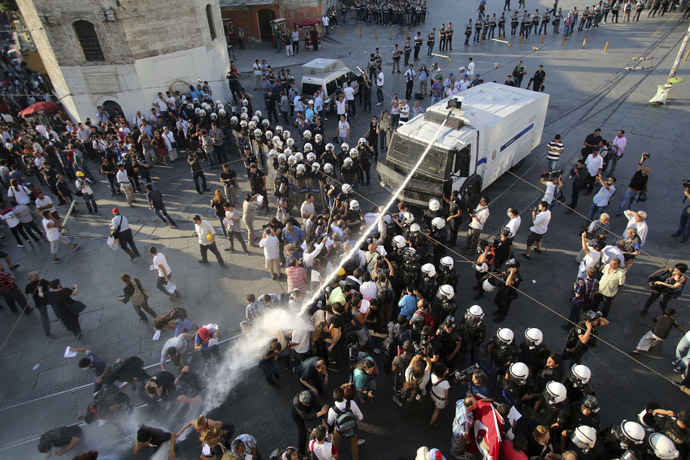 Riot police use a water cannon to disperse demonstrators during a protest at Taksim Square in central Istanbul July 6, 2013. (Reuters/Serkan Senturk)