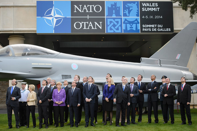 NATO Leaders watch a flypast of military aircraft on the second day of the NATO 2014 Summit at the Celtic Manor Resort in Newport, South Wales, on September 5, 2014. (AFP Photo/Leon Neal)