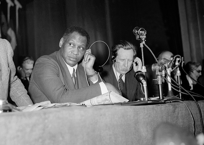US actor and singer Paul Robeson listens to a speech during the Peace Partisans World Congress in Moscow 20 April 1949 (AFP Photo)