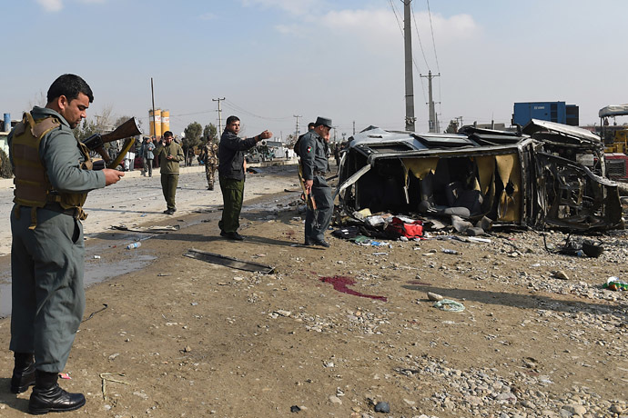 Afghan policemen inspect a British embassy vehicle which was targeted in a suicide attack along the Kabul-Jalalabad road in Kabul on November 27, 2014. (AFP Photo/Shah Marai)