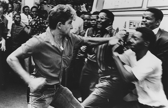 A supporter of South Africa's neo-Nazi Afrikaner Resistance Movement (AWB) tussles with a black onlooker at the supremacist movement's rally in Pretoria, South Africa. (Reuters/Raymond Preston)