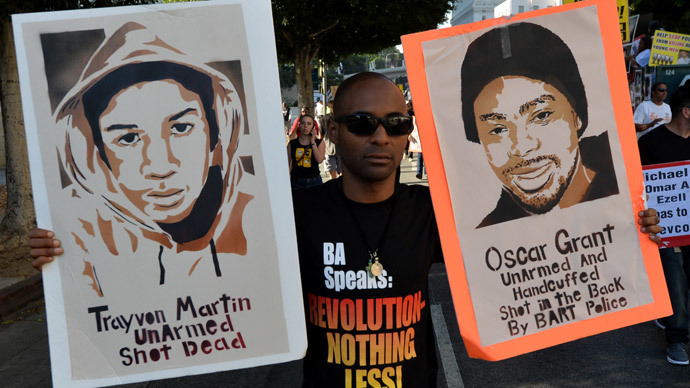 Demonstrators protest outside of the Los Angeles Police Department (LAPD) headquarters during their annual 'National Day of Protest to Stop Police Brutality', in Los Angeles, California on October 22, 2014.(AFP Photo / Mark Ralston)