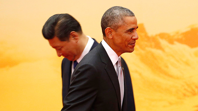 U.S. President Barack Obama (front) walks past his Chinese counterpart Xi Jinping during a welcoming ceremony of Asia Pacific Economic Cooperation (APEC) forum, inside the International Convention Center at Yanqi Lake, in Beijing, November 11, 2014 (Reuters / Kim Kyung-Hoon)