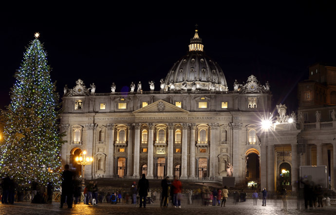 A Christmas pine tree stands in front of St Peter's basilica after it was illuminated during a ceremony on December 19, 2014 at the Vatican. (AFP Photo/Filippo Monteforte)