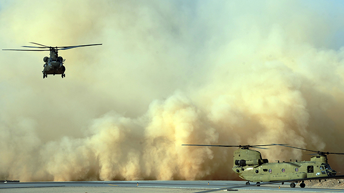 Two US army Chinook helicopters land at Kandahar airfield in southern Afghanistan on March 30, 2011 (AFP Photo)
