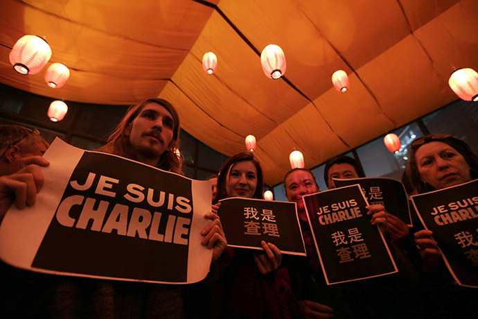 Foreign journalists and other people hold placards that read "I am Charlie" during a campaign at a bookstore in Beijing January 8, 2015 for the victims of the shooting at the Paris offices of weekly newspaper Charlie Hebdo on Wednesday. (Reuters/Jason Lee)