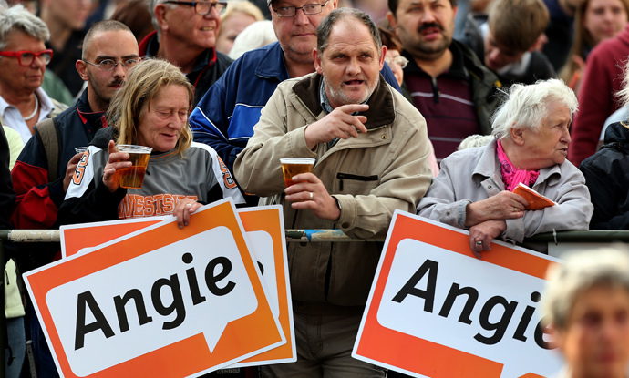 Supporters of German Chancellor Angela Merkel attend a CDU election rally in Magdeburg, eastern Germany (AFP Photo / Ronny Hartmann)