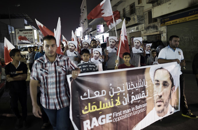 Bahraini men take part in a protest against the arrest of Sheikh Ali Salman, head of the Shiite opposition movement Al-Wefaq, in the village of Daih, west of Manama on January 6, 2015. (AFP Photo/Mohammed Al-Shaikh)
