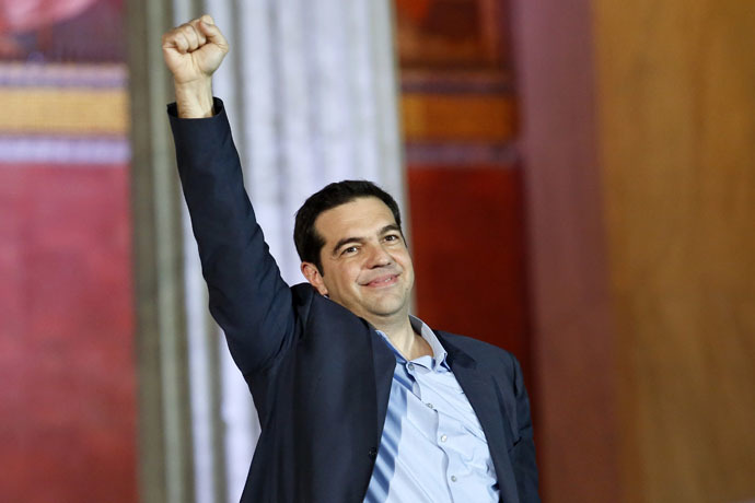 The head of radical leftist Syriza party Alexis Tsipras raises his fist to supporters after winning the elections in Athens January 25, 2015. (Reuters/Giorgos Moutafis)