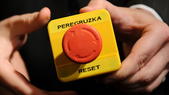 An assistant shows the mock "reset" button which U.S. Secretary of State Hillary Clinton handed to Russia's Foreign Minister Sergei Lavrov during a bilateral meeting in Geneva March 6, 2009. (Reuters/Fabrice Coffrini)