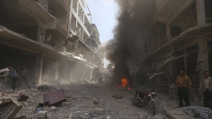 Smoke rises from fire at a site in central Douma, eastern al-Ghouta, near Damascus September 17, 2014 (Reuters / Bassam Khabieh)