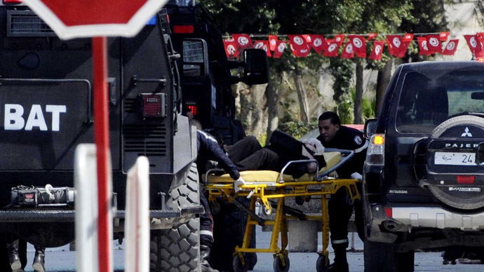 A tourist injured after an attack by gunmen on Tunisia's national museum is wheeled on a stretcher in Tunis March 18, 2015. (Reuters / Stringer)