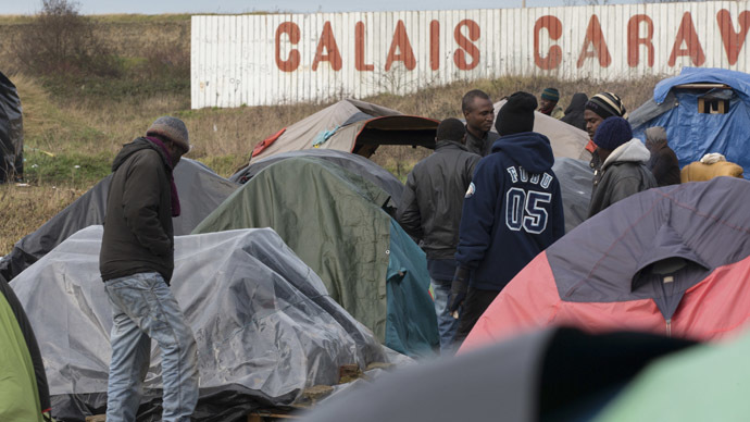 Sudanese migrants gather amongst tents in a camp in Calais. (Reuters/Philippe Wojazer)