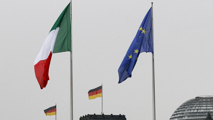 The national flags of Italy and Germany and the EU flag. (Reuters/Tobias Schwarz)