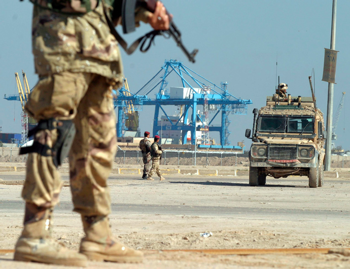 British soldiers secure the scene of a roadside bomb attack targeting British patrol in Um Qasr, an Iraqi port city near Basra, January 31, 2006. (Reuters/Atef Hassan)
