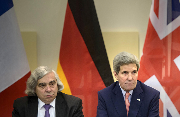 US Secretary of Energy Ernest Moniz (L) and US Secretary of State John Kerry wait for the start of a trilateral meeting at the Beau Rivage Palace Hotel in Lausanne (Reuters / Brendan Smialowski)