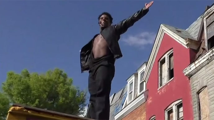 ‘Just chillax and think’: Dancing Michael Jackson impersonator to Baltimore protesters