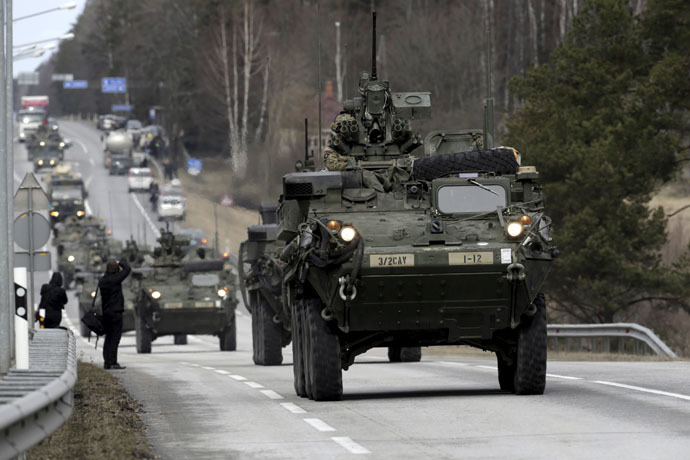 Soldiers of the U.S. Army 2nd Cavalry Regiment deployed in Estonia as a part of the U.S. military's Operation Atlantic Resolve, during the "Dragoon Ride" exercise move past Liepupe March 22, 2015. (Reuters/Ints Kalnins)