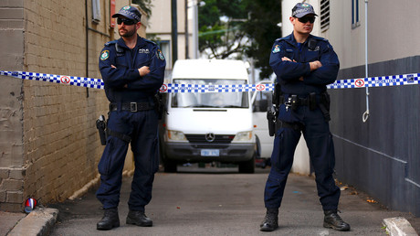 Des policiers australiens lors d'un raid antiterroriste le 29 juillet