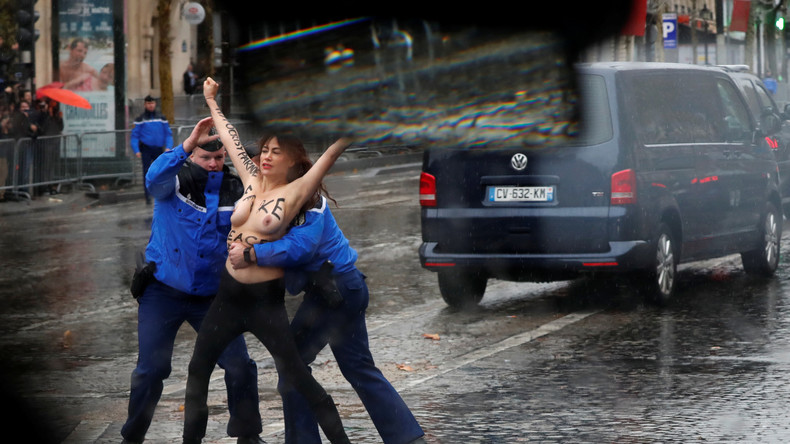 Trois Femen surgissent seins nus au passage de la voiture de Trump sur les Champs-Elysées (VIDEO)