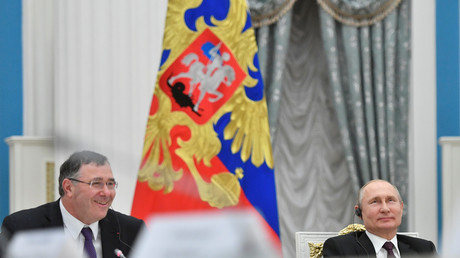 Le président russe Vladimir Poutine et le PDG de Total Patrick Pouyanné le 18 avril, à Moscou. 