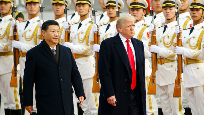 Donald Trump takes part in a welcoming ceremony with China's President Xi Jinping