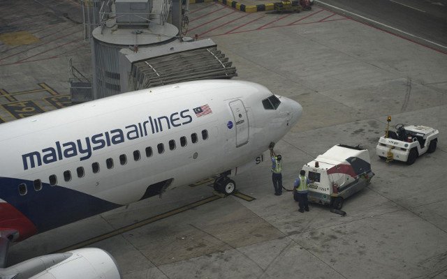 أول التعويضات لعائلات ضحايا الطائرة الماليزية المفقودة