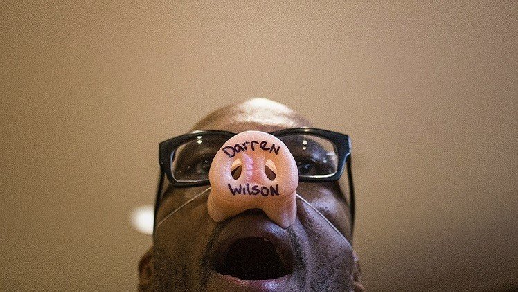 وزارة العدل الأمريكية تتخلى عن ملاحقة شرطي قتل شابا أسود في فيرغسون