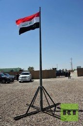 العلم العراقي مرفوع في الكرمة