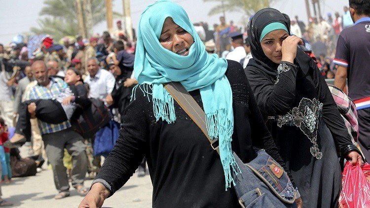 سكان الموصل يفرون إلى الأكراد السوريين 