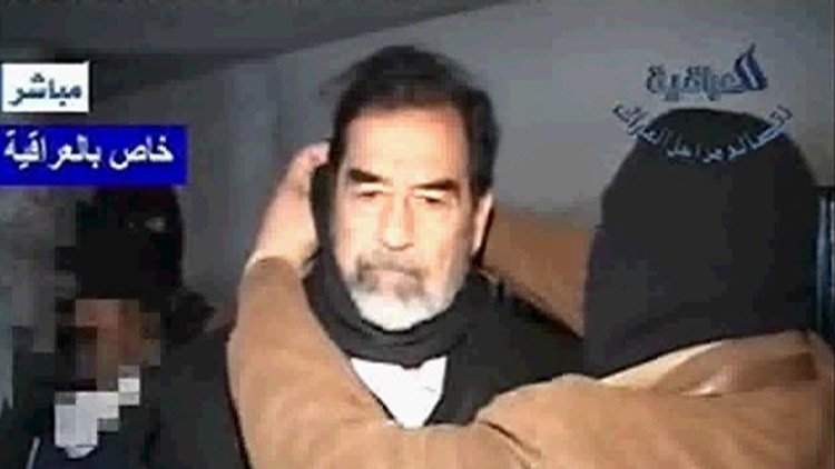 متى تم التوقيع على مذكرة إعدام صدام حسين؟