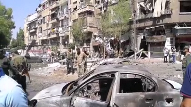 شاهد الدمار الذي خلفه تفجير سيارة مفخخة قرب ساحة التحرير في دمشق
