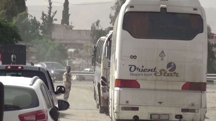 تواصل خروج المسلحين وعائلاتهم من بلدات يلدا وببيلا وبيت سحم جنوب دمشق