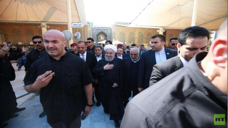 بالصور.. روحاني يزور ضريح الإمام علي في النجف