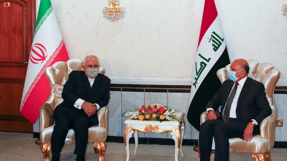 ظريف يصل بغداد ويزور مكان اغتيال سليماني ويلتقي نظيره العراقي (صور)