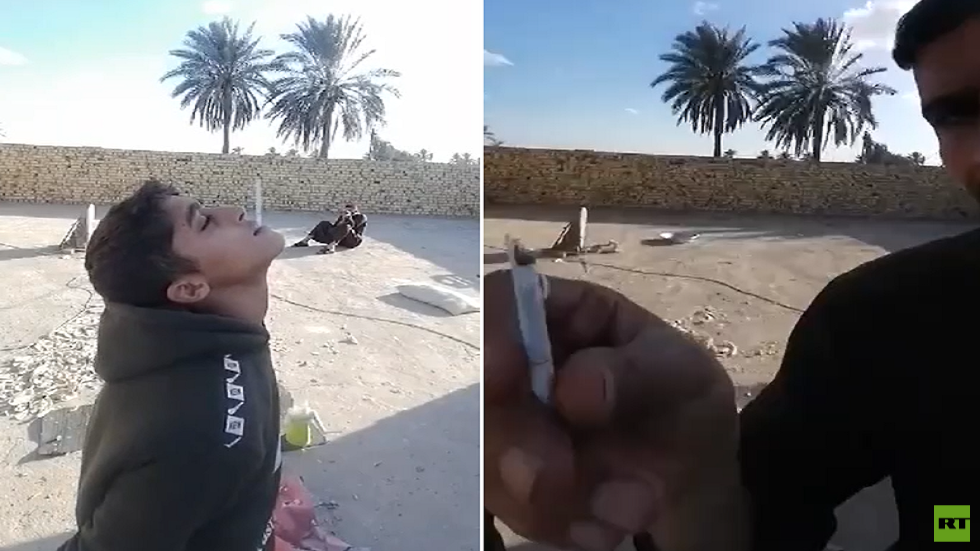 فيديو صادم.. السلطات العراقية تعتقل رجلا استخدم طفلا لاستعراض مهاراته في التصويب بالسلاح!