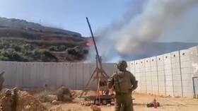 الجيش الإسرائيلي يستعين بمنجنيق لقذف جنوب لبنان بكرات نارية (فيديو)