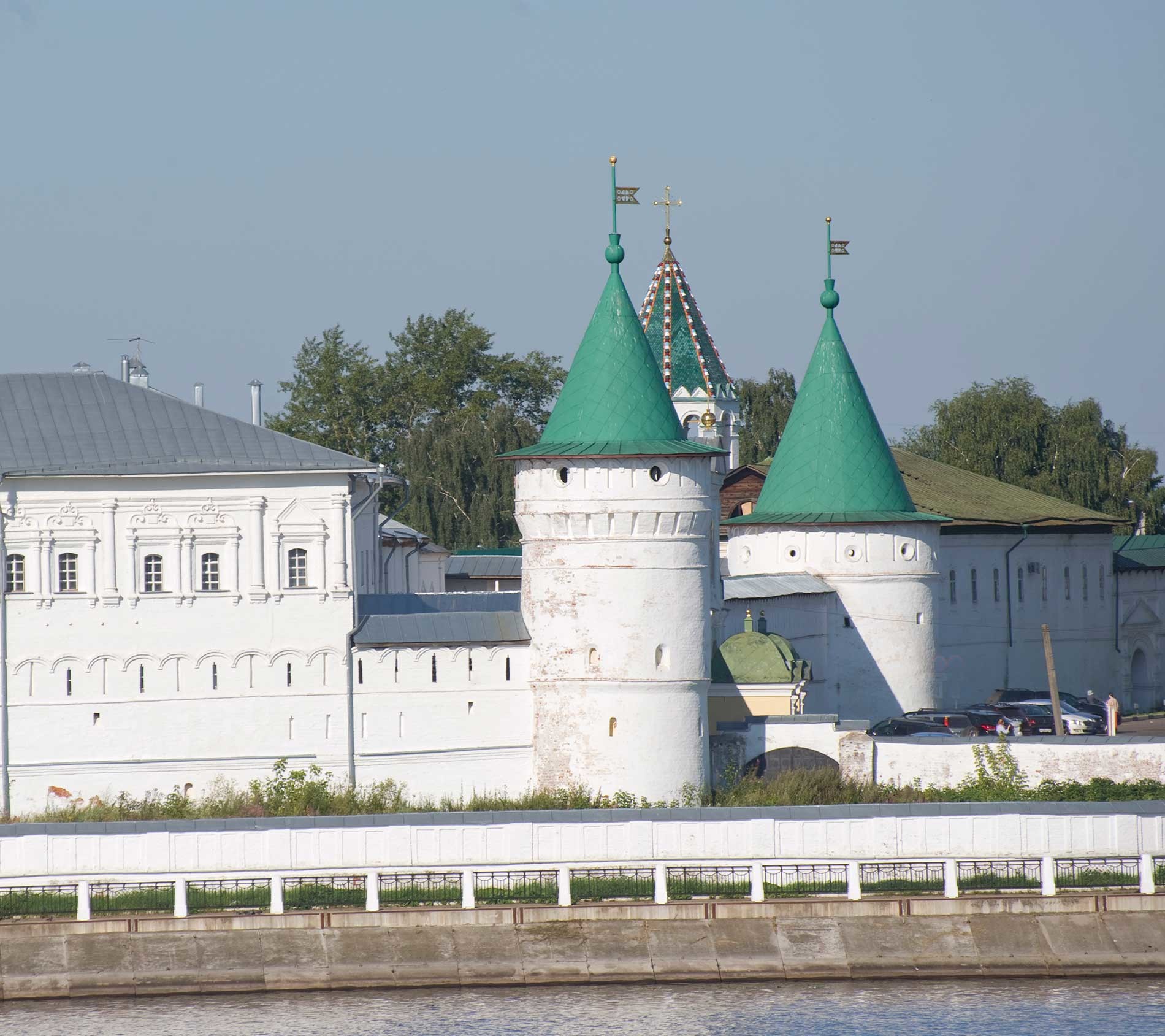 Trinity-Ipatiev Monastery, east view across Kostroma River. From left: Archbishop's Cloisters; Powder Tower; Green Tower (background); Catherine (North) Gate; Smithy Tower. Aug. 13, 2017.