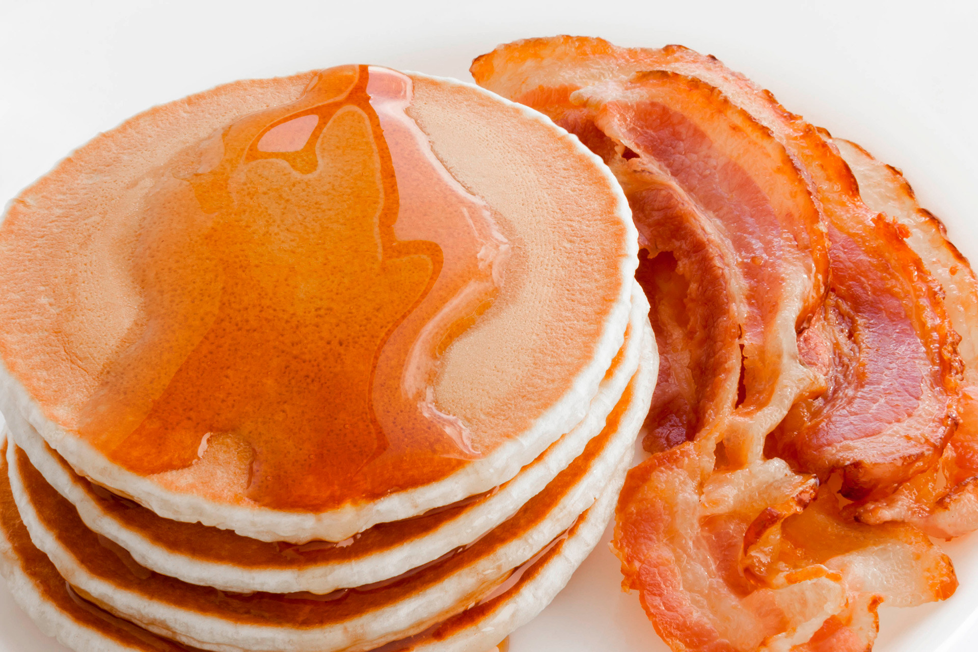 Pancakes with maple syrup and bacon.