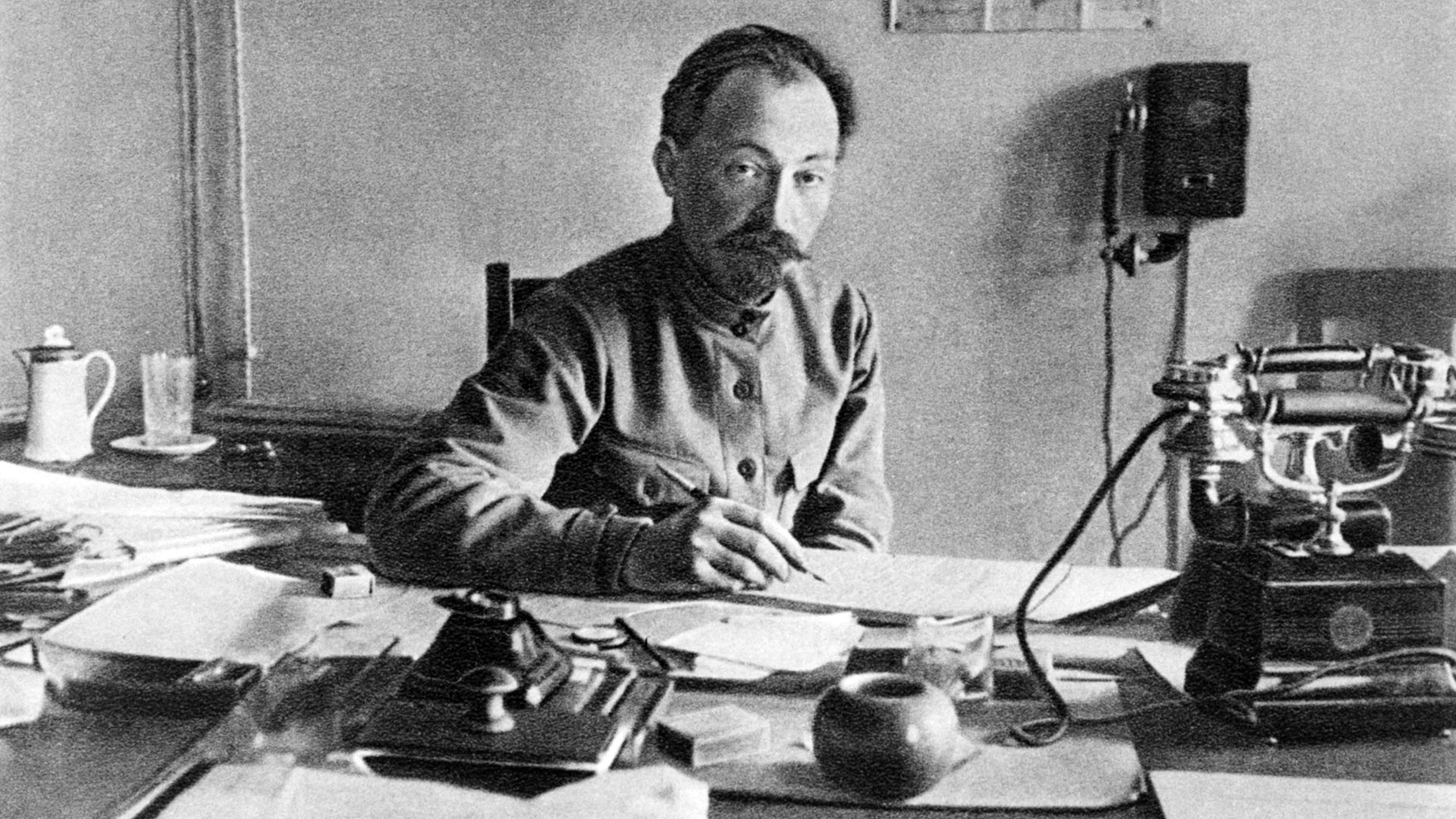 'Iron Felix' behind his working table. Maybe he is signing execution orders - or, perhaps, establishing another orphanage. 