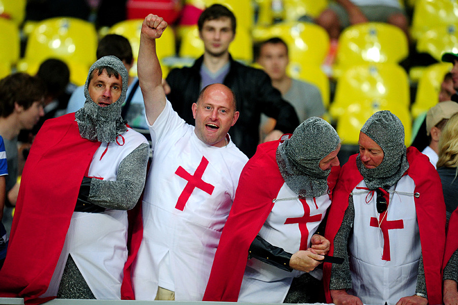 Supporters of the English team watch action in the RWC Sevens 2013 Men's Tournament Final match between England and New Zealand at Luzhniki Stadium