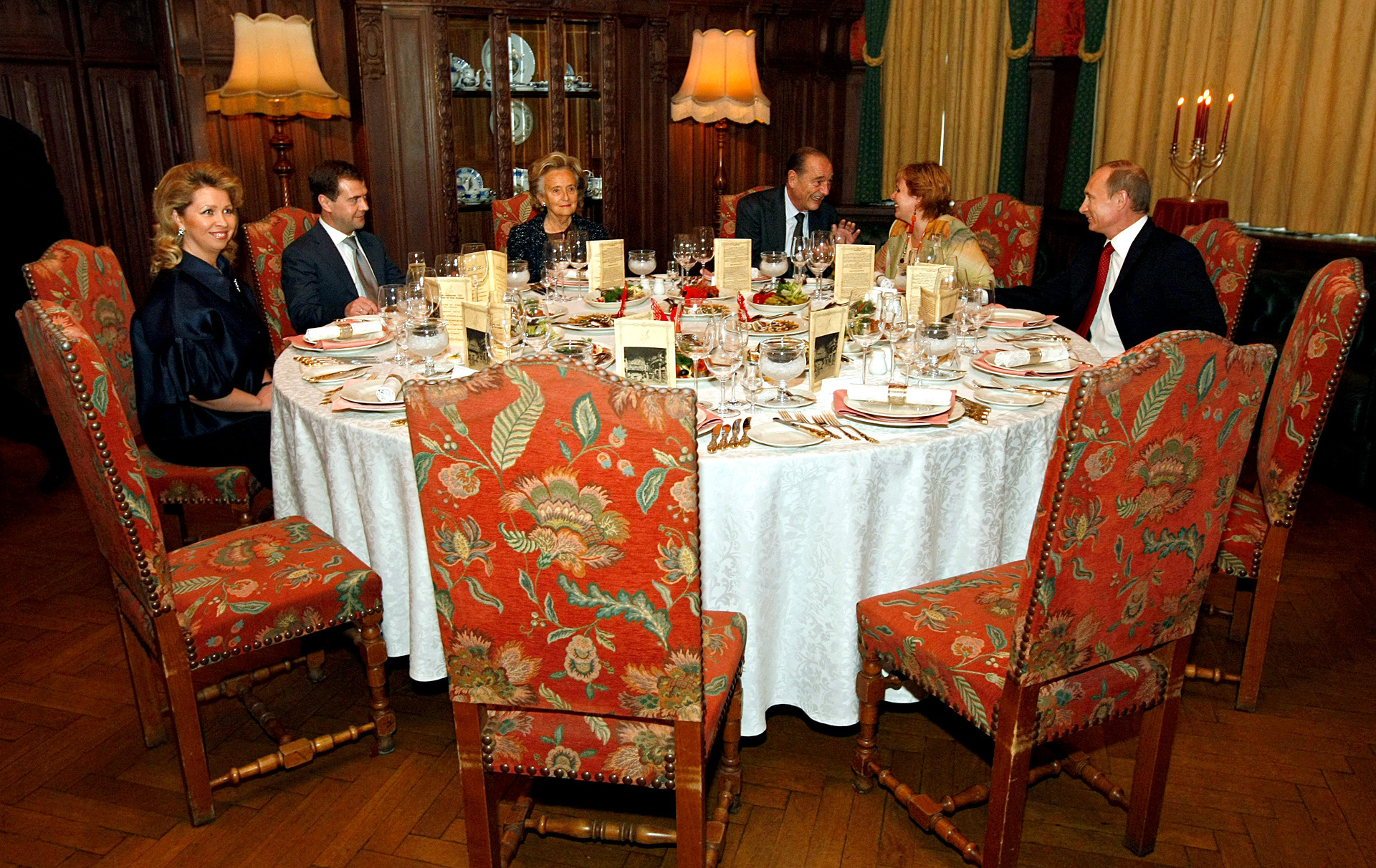 Russian Prime Minister Vladimir Putin with wife Lyudmila, former French President Jacques Chirac with wife Bernadette and President of Russia Dmitry Medvedev wife Svetlana