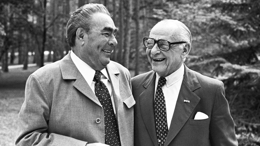 Leonid Brezhnev and Armand Hammer talk during a meeting.