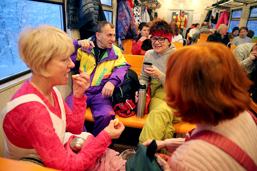 People on a 'Lyzhnaya Strela' (Ski arrow) train, a free of charge train which takes people to ski-runs.