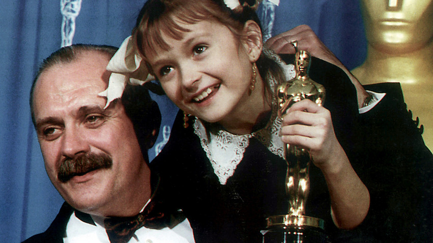 Film-maker, actor Nikita Mikhalkov, winner of the Best Foreign Language Film Oscar from his movie "Burnt by the Sun", and his daughter Nadya, who appeared in one of the lead roles in that movie, holding Oscar figurine.