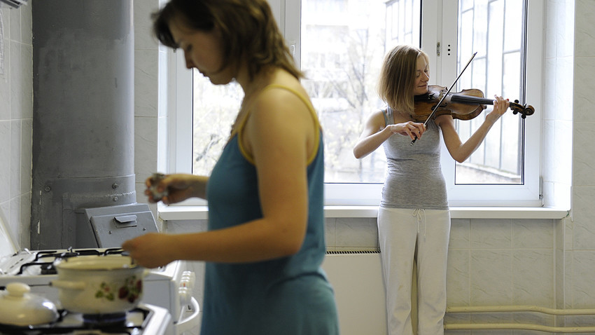 A student of the Moscow Tchaikovsky Conservatory prepares for a lesson at a dormitory room