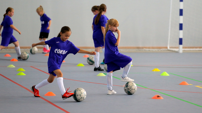 Girls at a football training session Sokol Olympic Reserve Sports School No. 27 of the Moscow Department of Sport and Tourism.